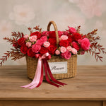 Load image into Gallery viewer, Wicker basket filled with red and pink roses on a wooden surface, with &#39;Fleurim&#39; label.
