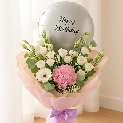 Bouquet of flowers with a 'Happy Birthday' balloon on a light background
