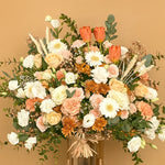 Load image into Gallery viewer, Bouquet of flowers with a mix of colors on a beige background
