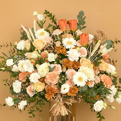 Bouquet of flowers with a mix of colors on a beige background
