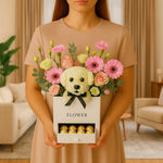 Load image into Gallery viewer, Person holding a box of flowers with a dog-shaped center in a living room setting
