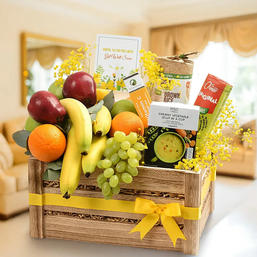 Fruit basket with a variety of fruits and snacks on a table.