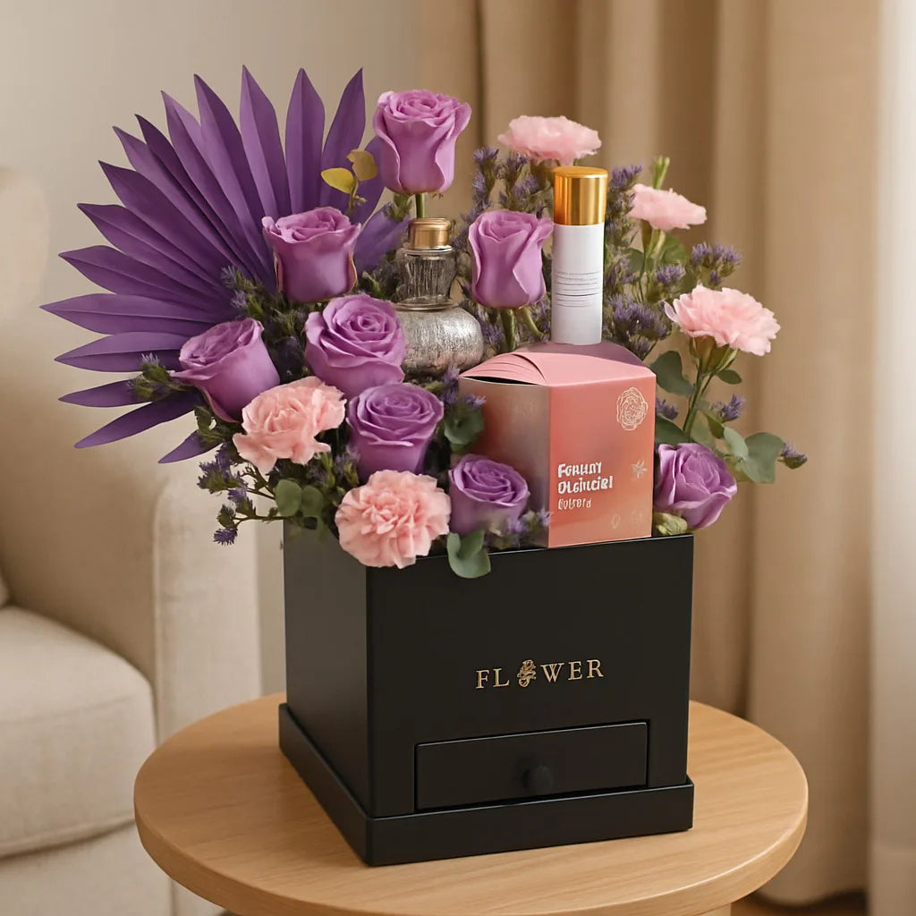 Floral arrangement with a black box labeled 'FLOWER' on a wooden table.